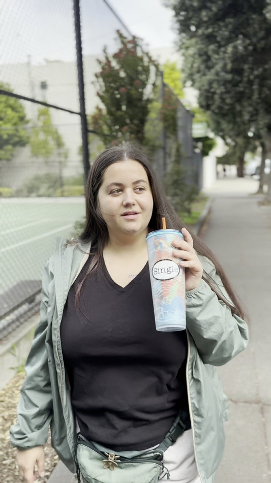 Angelina strolls with a Single® Medium Sticker on her mug.