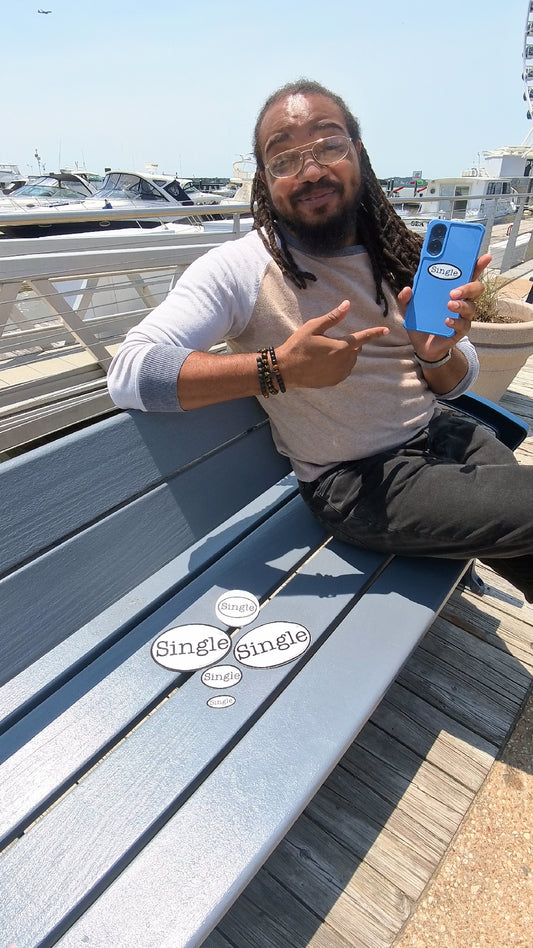 Dwight site with Single® Bundle No. 3, consisting of Single® labeled small, medium and large stickers, magnet and drink coaster.