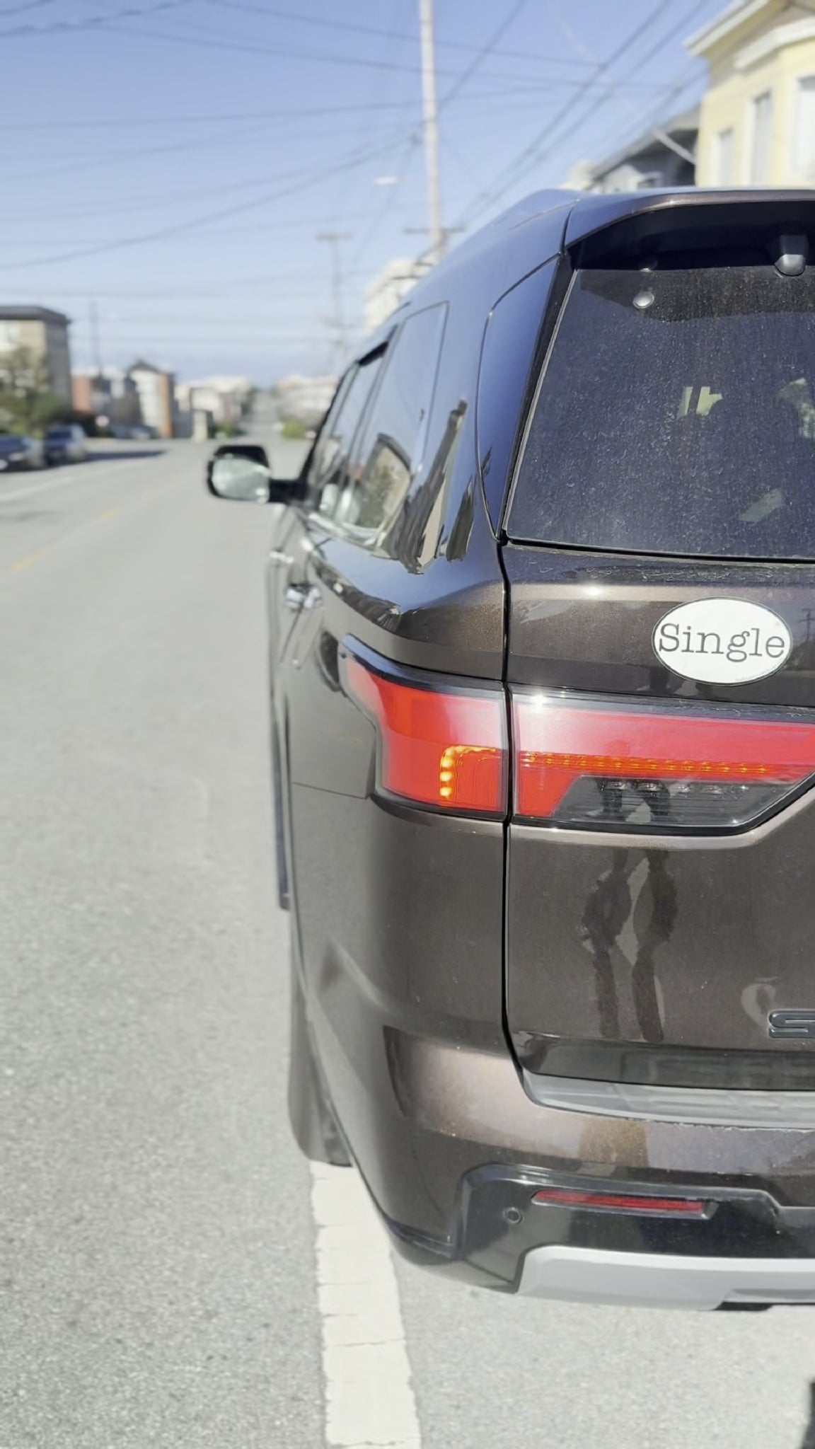 Angelina’s SUV drives off with a Single® Large Sticker to break the ice while sitting in traffic. 
