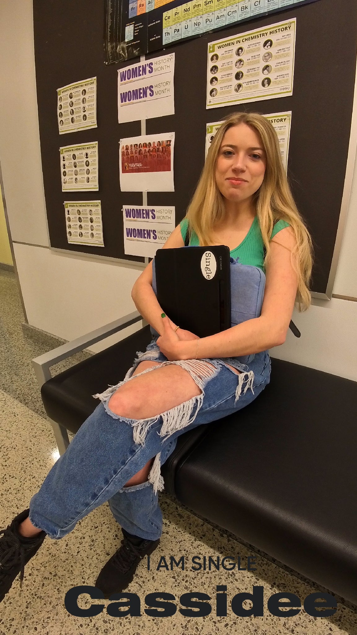 Cassidee waits for class holding her tablet with the Single® Medium Sticker applied to it.