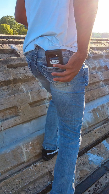 Jason shows that he is member of the Single® community by leaving his phone (with a Single® Small Sticker) hanging out of his jean pocket.
