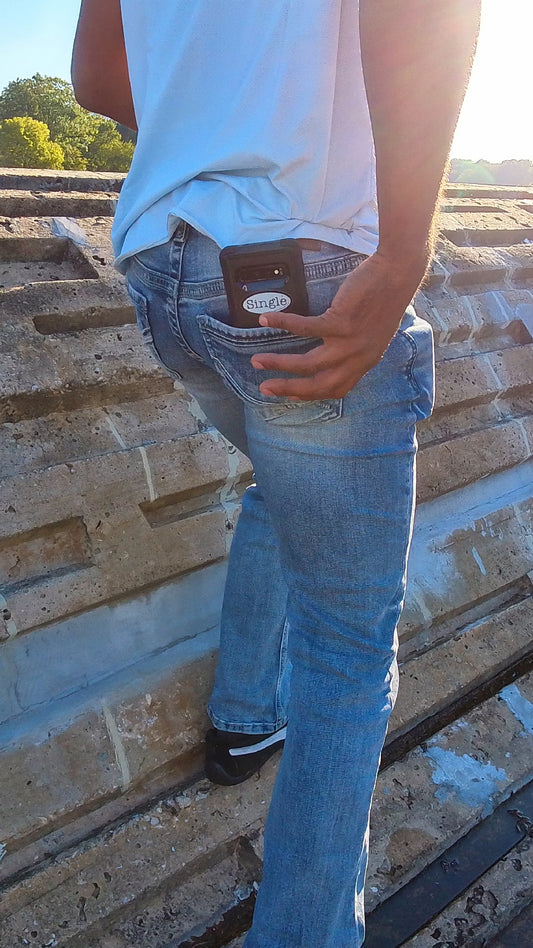 Jason shows that he is member of the Single® community by leaving his phone (with a Single® Small Sticker) hanging out of his jean pocket.