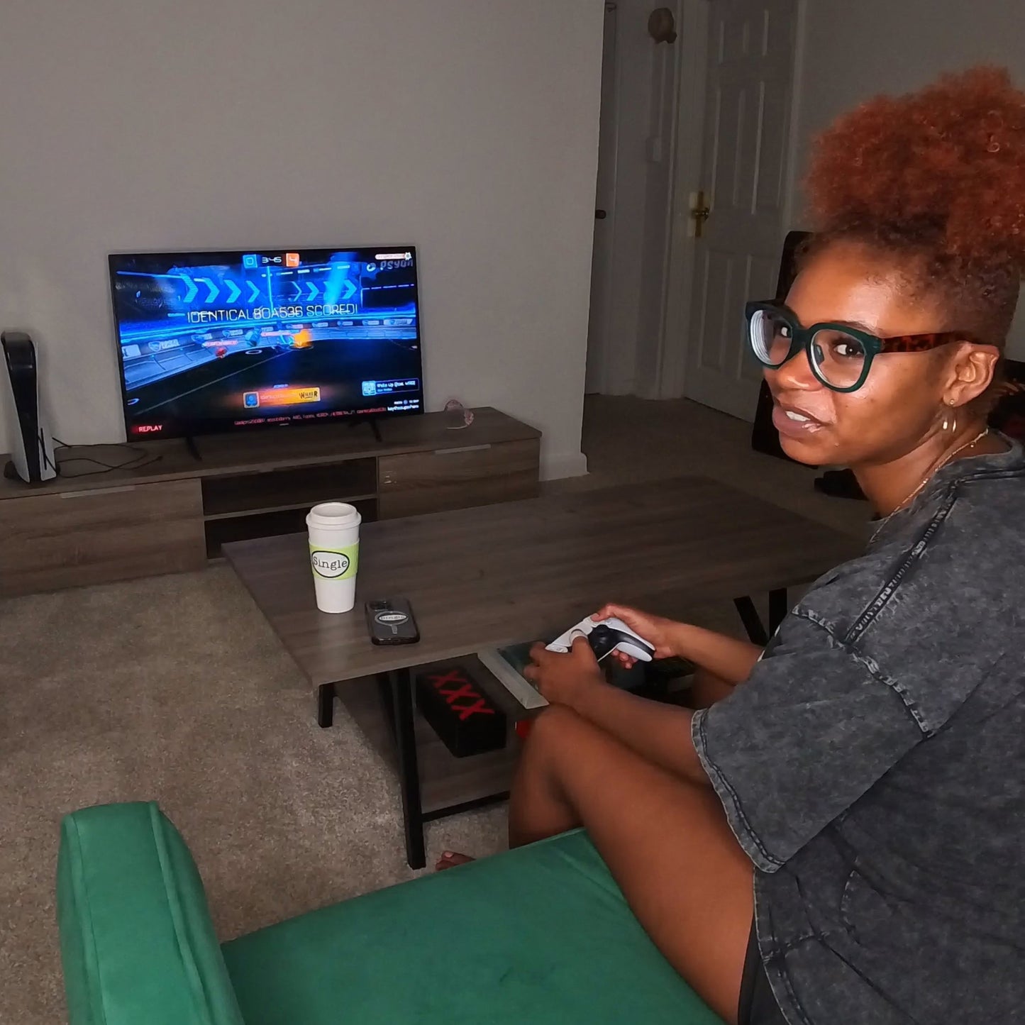 Gamer Kayla stops mid-game to “Push Back”.  Note the Single® Medium Sticker on her coffee mug and the Single® Small Sticker on her phone .