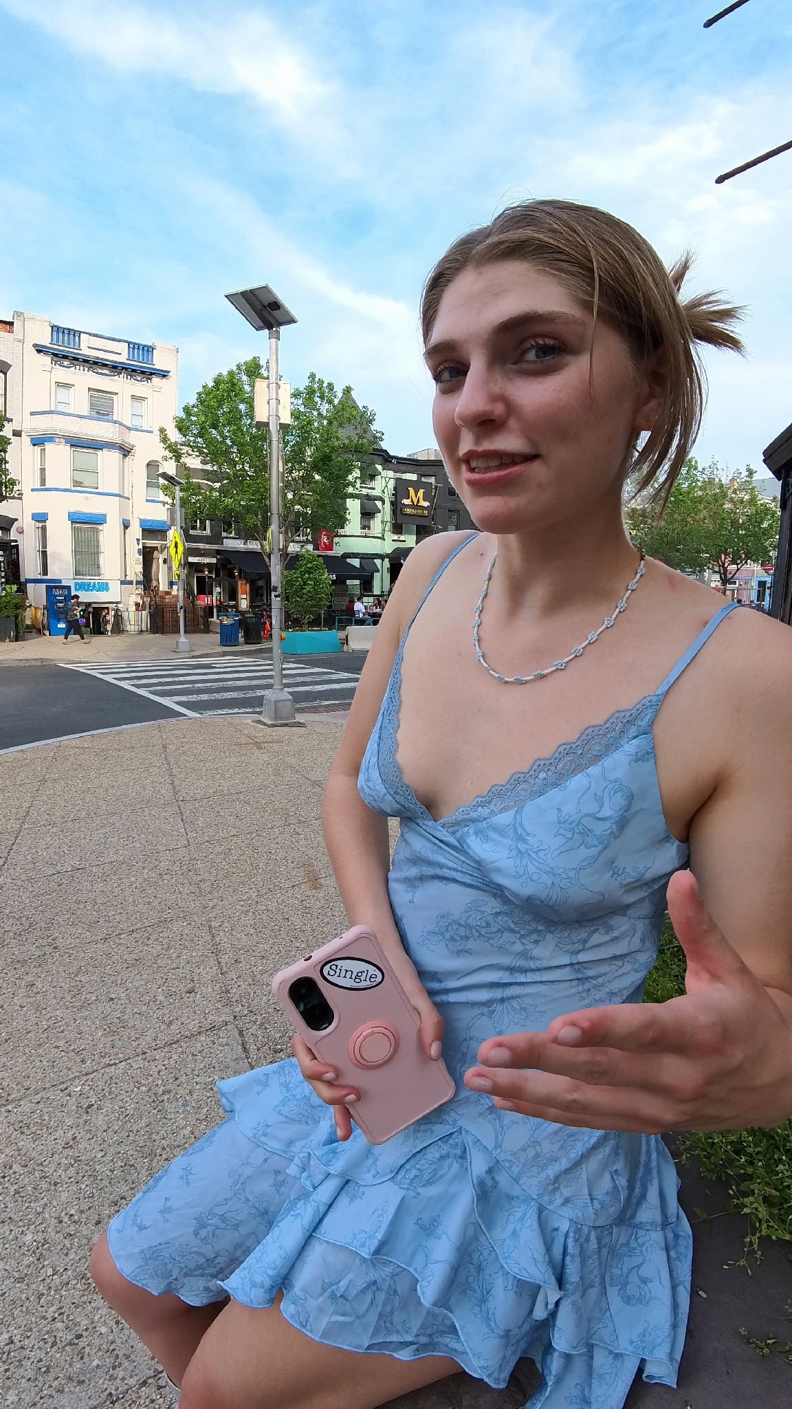 Maeve with a Single® Small Sticker on her phone.