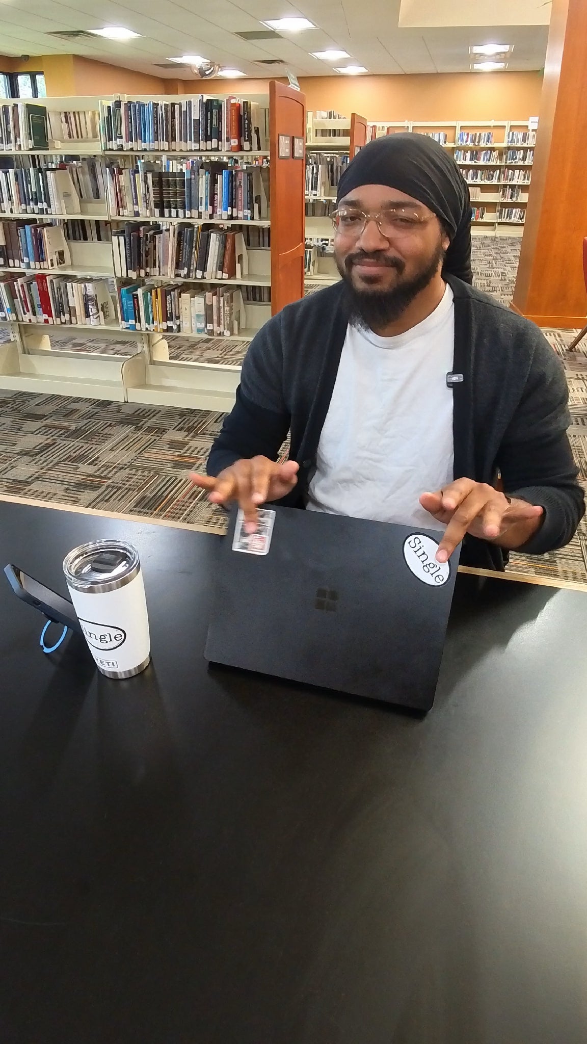 Dwight’s tablet and tumbler have Single® Medium Stickers applied to them.