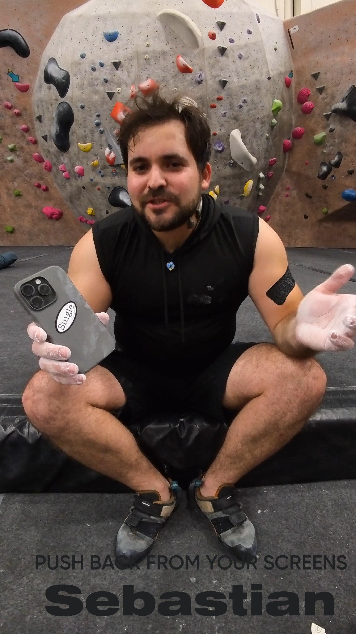 Sebastian with a Single® Small Sticker on his phone while at the local climbing gym.