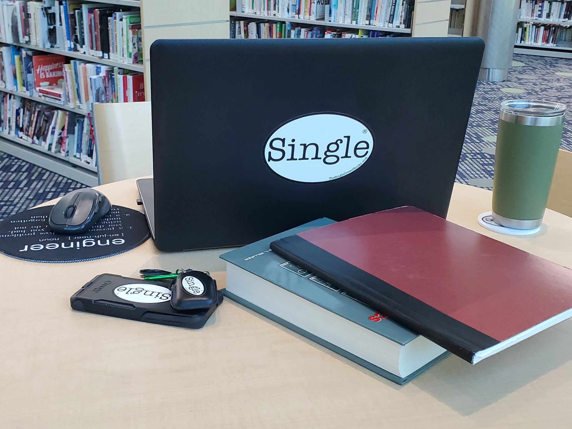A Single® Crowd Rocks community member displays a Single® Large Sticker on their laptop.