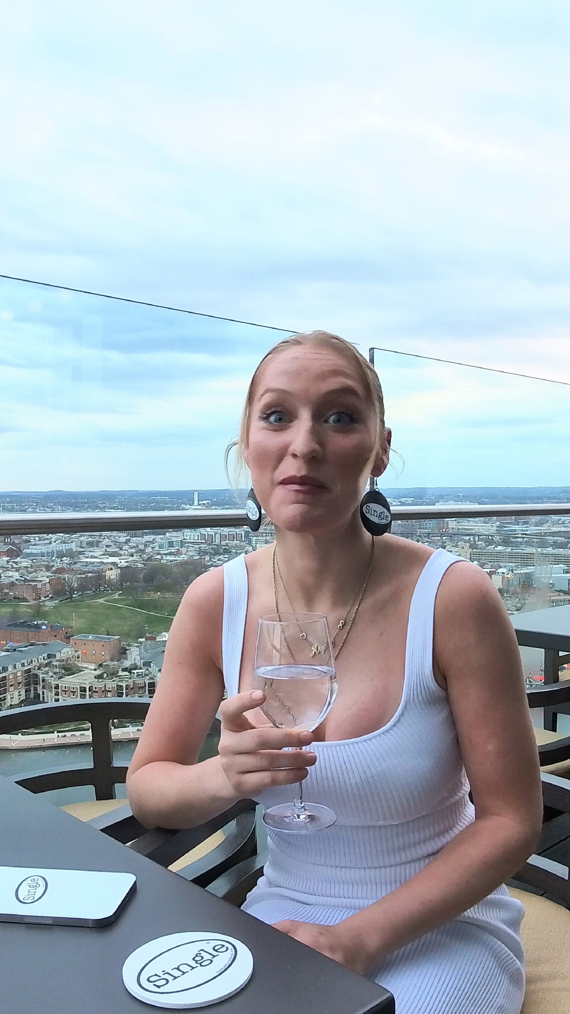 Goofing off with Sydney  during her “Best First Date” interview.  Single® Small Sticker on her earrings and phone, and a Single® Drink Coaster to really break the ice.