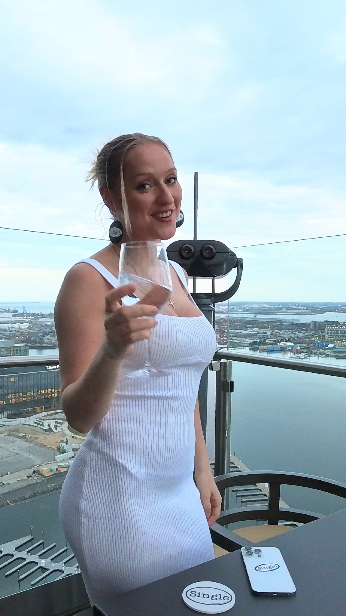 Sydney with the Single® labeled Drink Coaster.